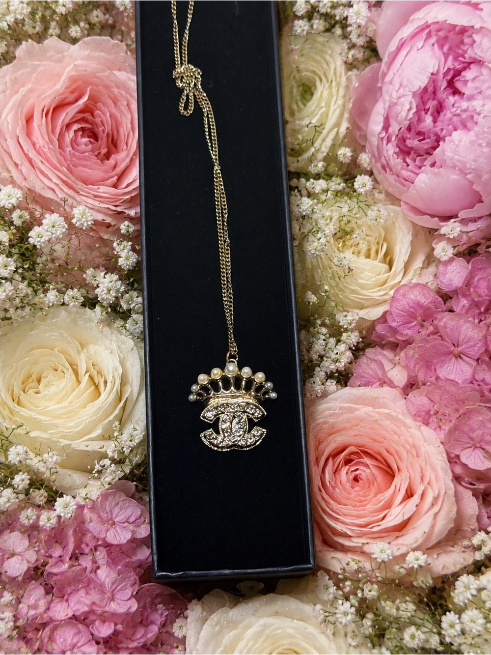 Chanel light pink crystal CC crown pendant necklace.